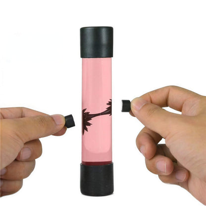 Venom symbiote ferrofluid kit with a clear tube, black caps, and hands manipulating the fluid inside.