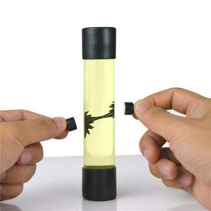 Venom symbiote ferrofluid kit with a clear tube and black caps, showcasing fluid movement when manipulated.
