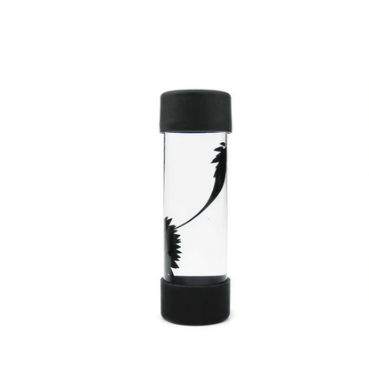 Venom symbiote ferrofluid kit in a clear cylindrical container with black ends, showcasing fluid movement.